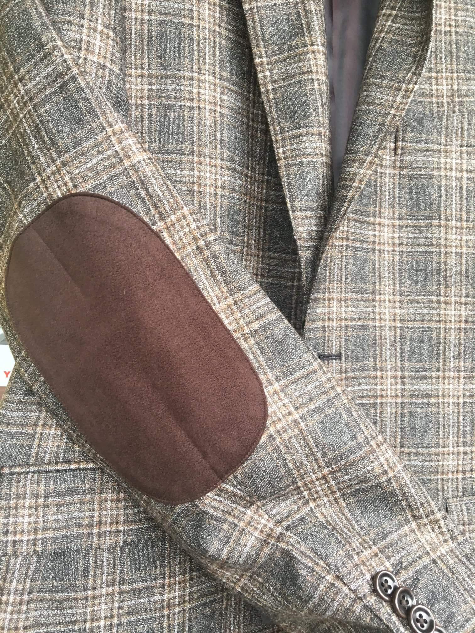 Tweed coat with leather elbow patches.